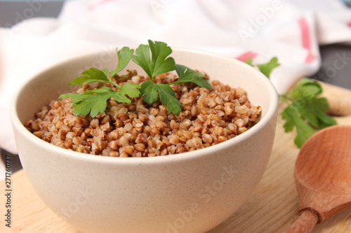 boiled buckwheat in a plate on the table.