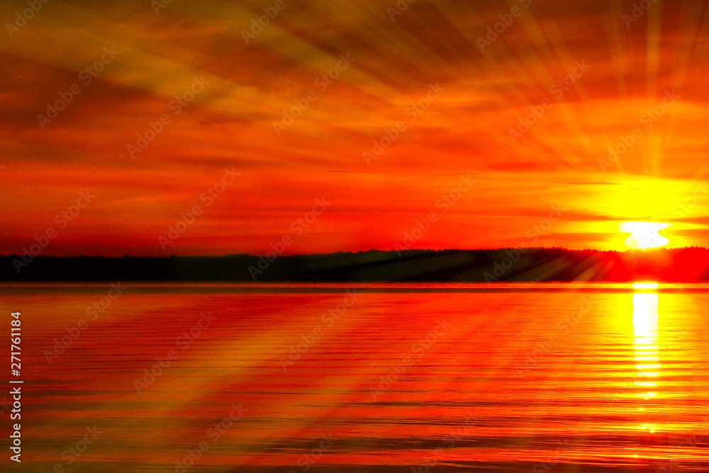 Sunbeams On a bright sunset by the lake, red