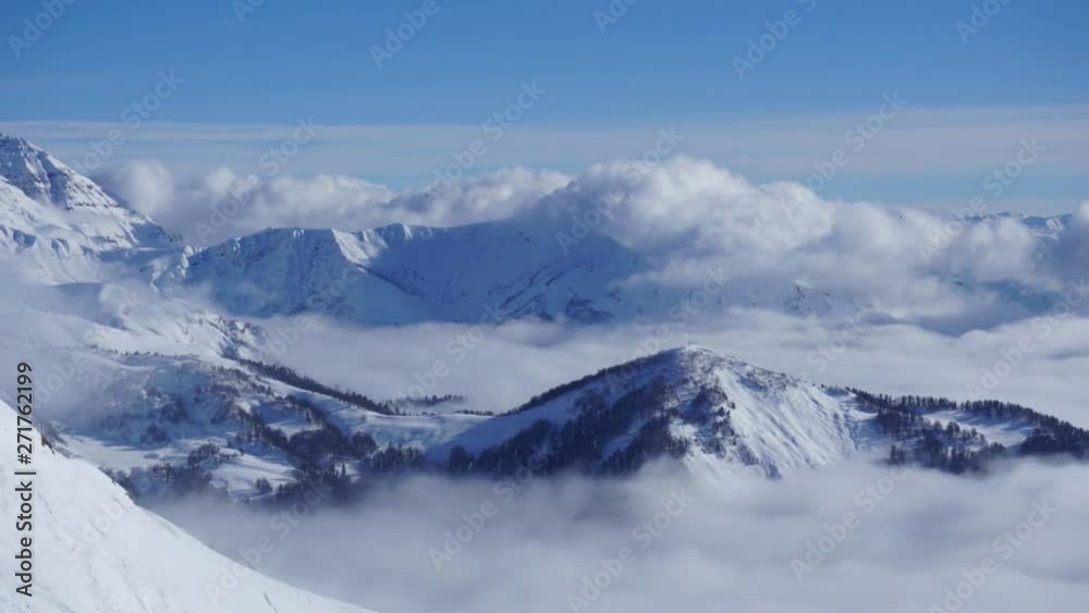 White clouds flying over Caucasus mountain landscape, valley, and the forest. Time lapse.