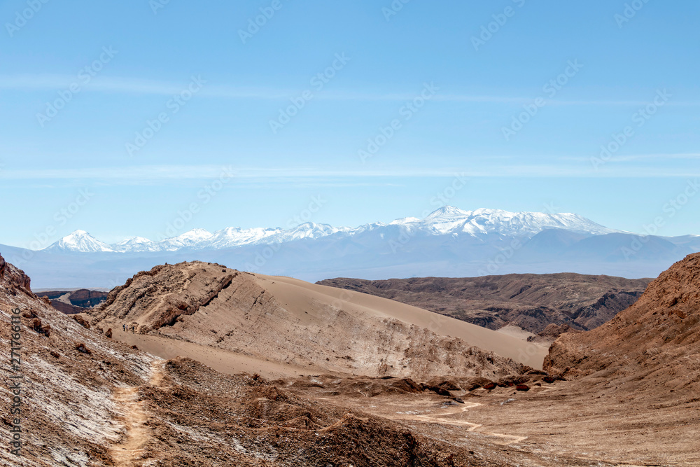 Moonlike landscape of dunes, rugged mountains and rock formations of Valle de la Luna (Moon valley), Atacama desert, Chile
