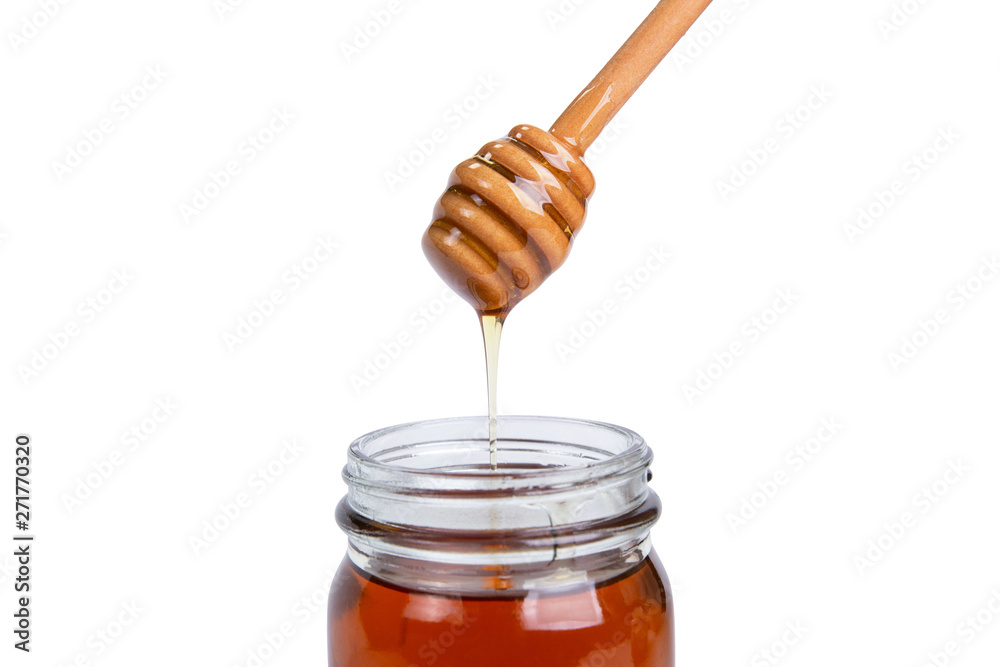 Glass jar honey and dipper high above isolated on white background Glass jar honey and dipper high above isolated on white background