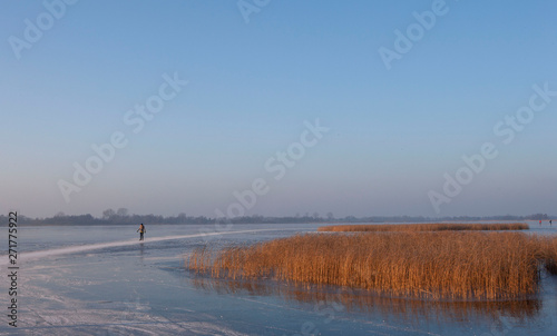 Ice skating. Winter in National park the Weerribben Overijssel Netherlands