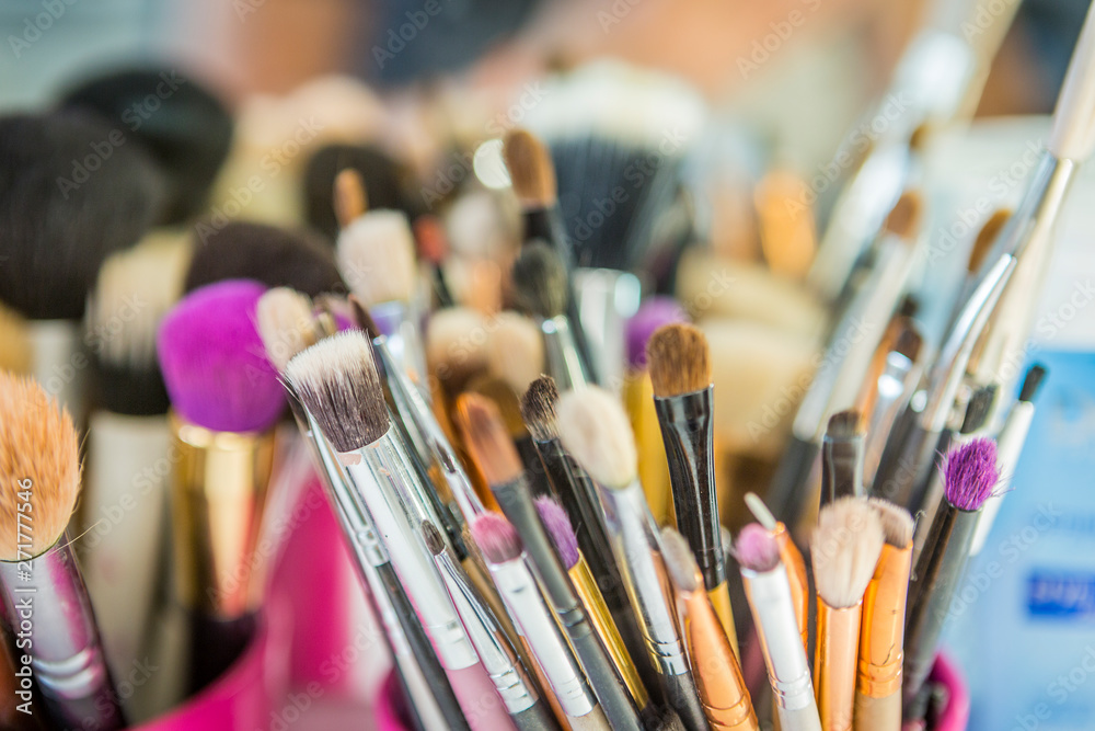Fototapeta premium makeup accessories, brushes, palette, make-up and make-up. working environment of make-up artist. makeup background.