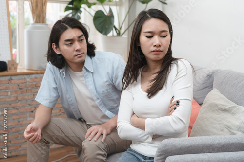 Love problem concept. Asian couple having quarrel at home.