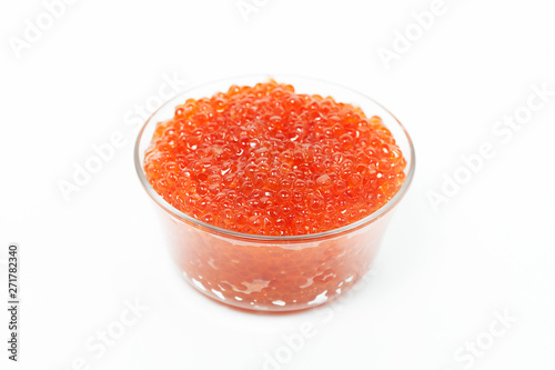 Red caviar in glass bowl isolated on white background