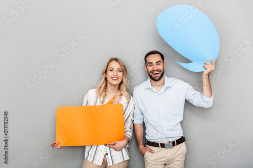 Attractive young couple standing isolated