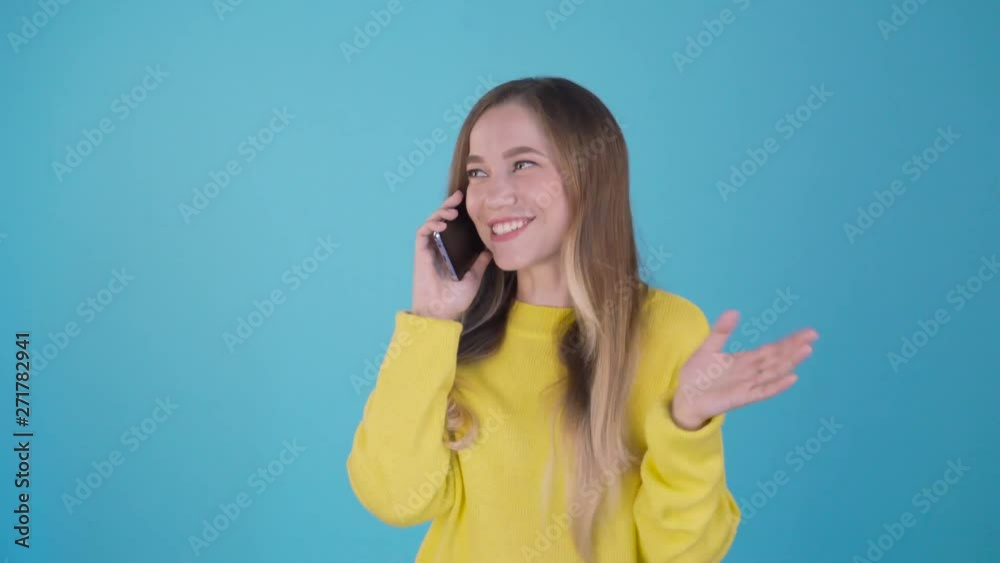 Close up photo beautiful she her lady arm hand telephone speak talk say tell friends relatives laughter crazy humor joke story wear specs formal-wear costume suit isolated blue vibrant background. 4K Close up photo beautiful she her lady arm hand telephone speak talk say tell friends relatives laughter crazy humor joke story wear specs formal-wear costume suit isolated blue vibrant background. 4K