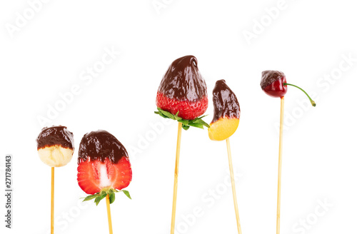 chocolate covered food on fondue stick photo