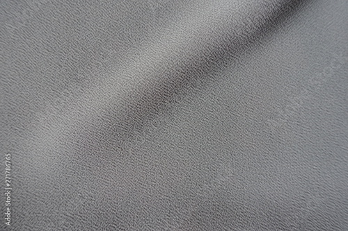 Single diagonal soft folds on grey crepe georgette fabric