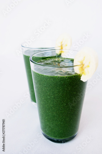 Fresh green kale, banana, coconut milk, spirulina powder and flax seeds smoothie. Healthy lifestyle, vegan food