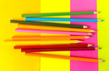 .multi-colored pencils lie on a multi-colored background