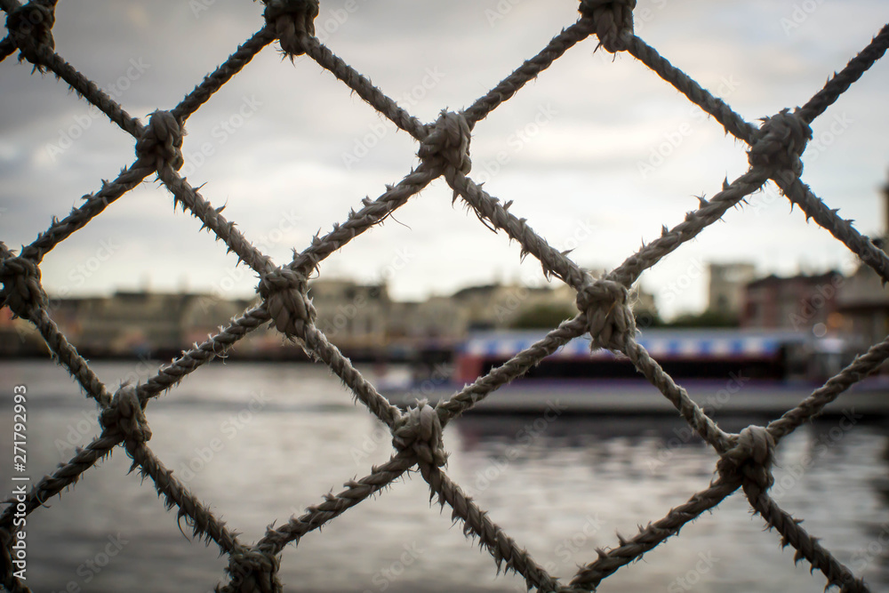 Netted fence with blurred background Netted fence with blurred background