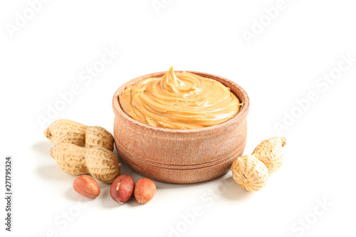 Tableau sur toile Creamy peanut butter in glass bowl and peanut isolated on white background
