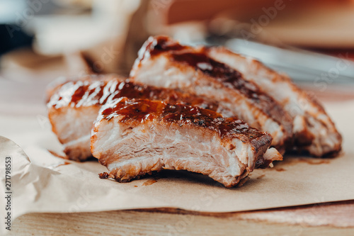 Closeup of pork ribs grilled with BBQ sauce and caramelized in honey. 
