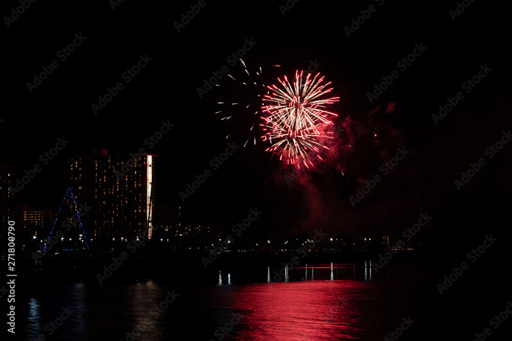 Friday night fireworks at Waikiki Beach, Honolulu cityscape at night, with negative space of blackness. Friday night fireworks at Waikiki Beach, Honolulu cityscape at night, with negative space of blackness.