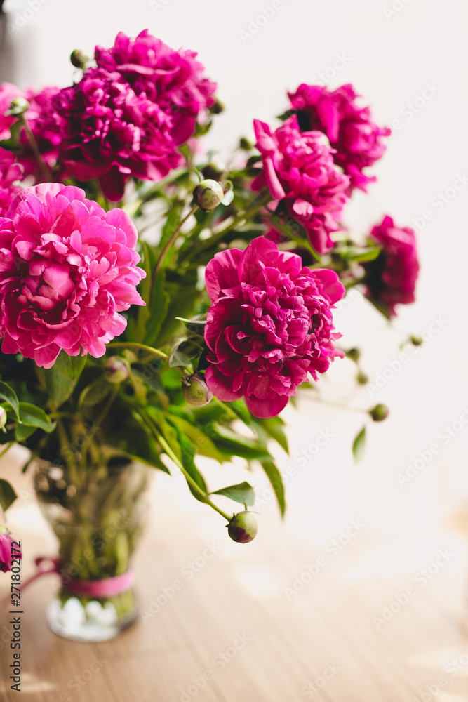Fototapeta premium Elegant bouquet of a lot of peonies of pink color close up. Beautiful flower for any holiday. Lots of pretty and romantic flowers in floral shop. Bouquet of a lot of peonies of pink color close up.