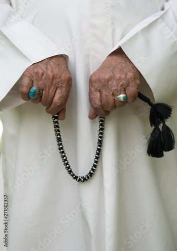 Man counting muslim prayer beads, Fars province, Shiraz, Iran photo