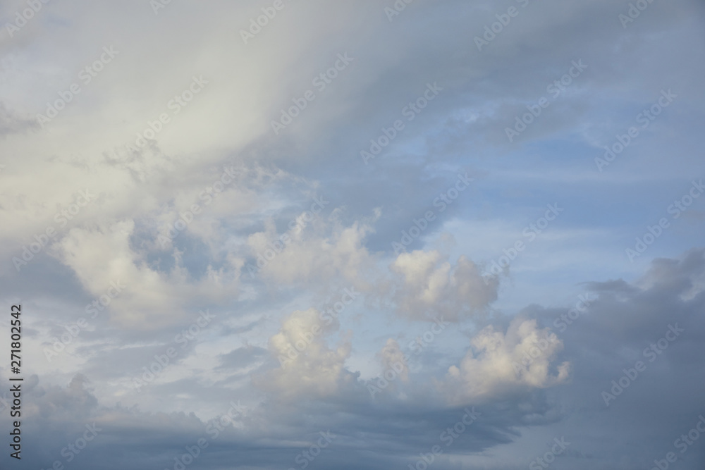 view of white and grey clouds on blue sunlight sky background
