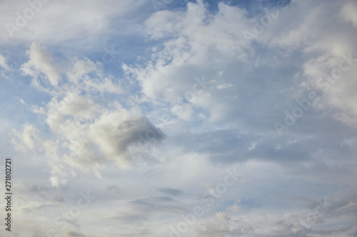 white clouds on calm blue sky background © LIGHTFIELD STUDIOS