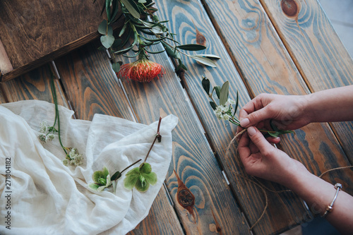 The preparation of the bonbonniere. Florist shop, wedding preparation. photo