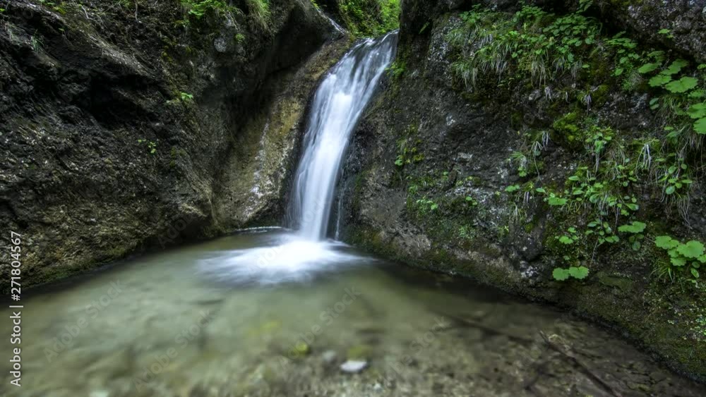 Mountain stream waterfall between rocks deep in the forest 4k time lapse Mountain stream waterfall between rocks deep in the forest 4k time lapse