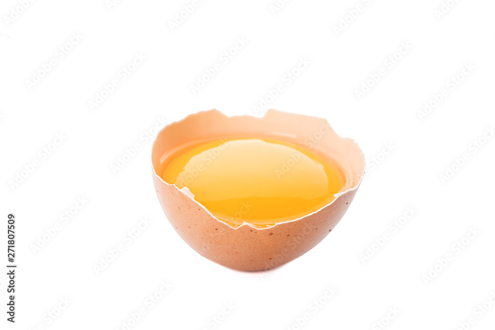 Half broken egg with yolk isolated on white background Half broken egg with yolk isolated on white background