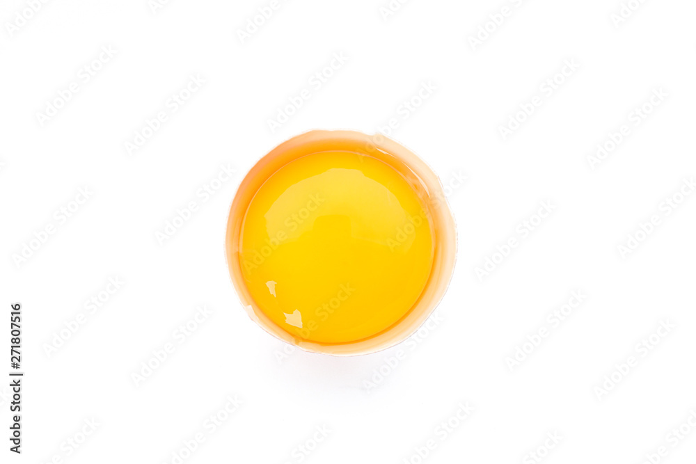 Half broken egg with yolk isolated on white background, top view