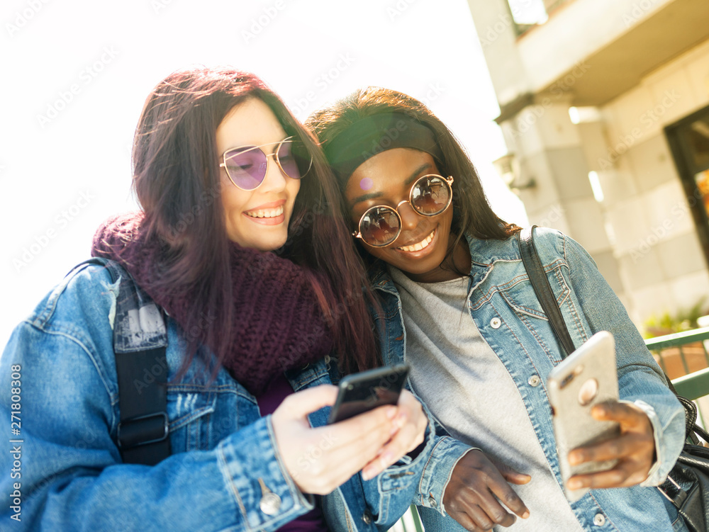 Two happy friends of caucasian and African ethnicity Two happy friends of caucasian and African ethnicity