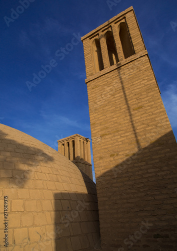 Wind towers used as a natural cooling system for water reservoir in iranian traditional architecture, Isfahan Province, Ardestan, Iran photo