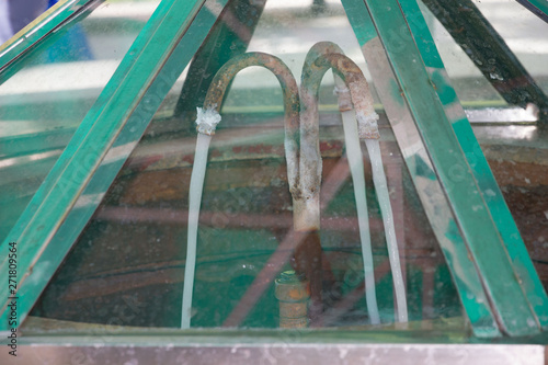Georgian mineral water Borjomi on famous balneary resort, Georgia. Spring water supply system photo