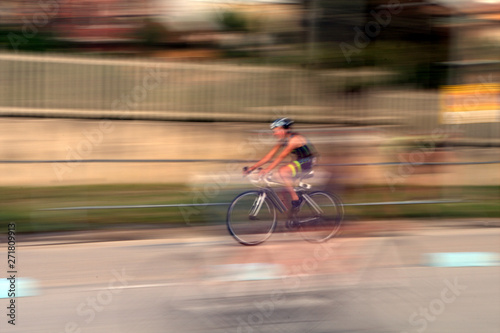 bicycle on the road,race,speed,cyclist,motion,competition,fast,cycle,blur