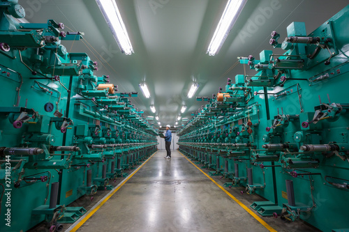 Engineer checking quality the rope kevlar fiber on process production line in the industrial factory