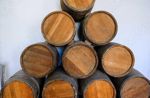 Wine barrels in the cellar. Wine cellar at the factory. © Igor Luschay