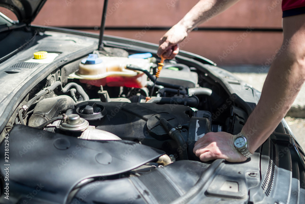 car repair open hood worker