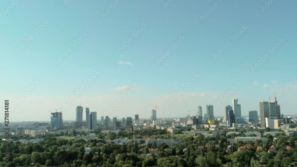 Aerial View of Warsaw City - Capital of Poland - with Skyscrapers, Palace of Culture and Science and Green Park on Summer Day. 4K Quadcopter Pan Shot Aerial View of Warsaw City - Capital of Poland - with Skyscrapers, Palace of Culture and Science and Green Park on Summer Day. 4K Quadcopter Pan Shot