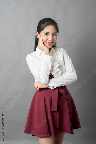 Portrait of beautiful business woman on grey background, studio shot