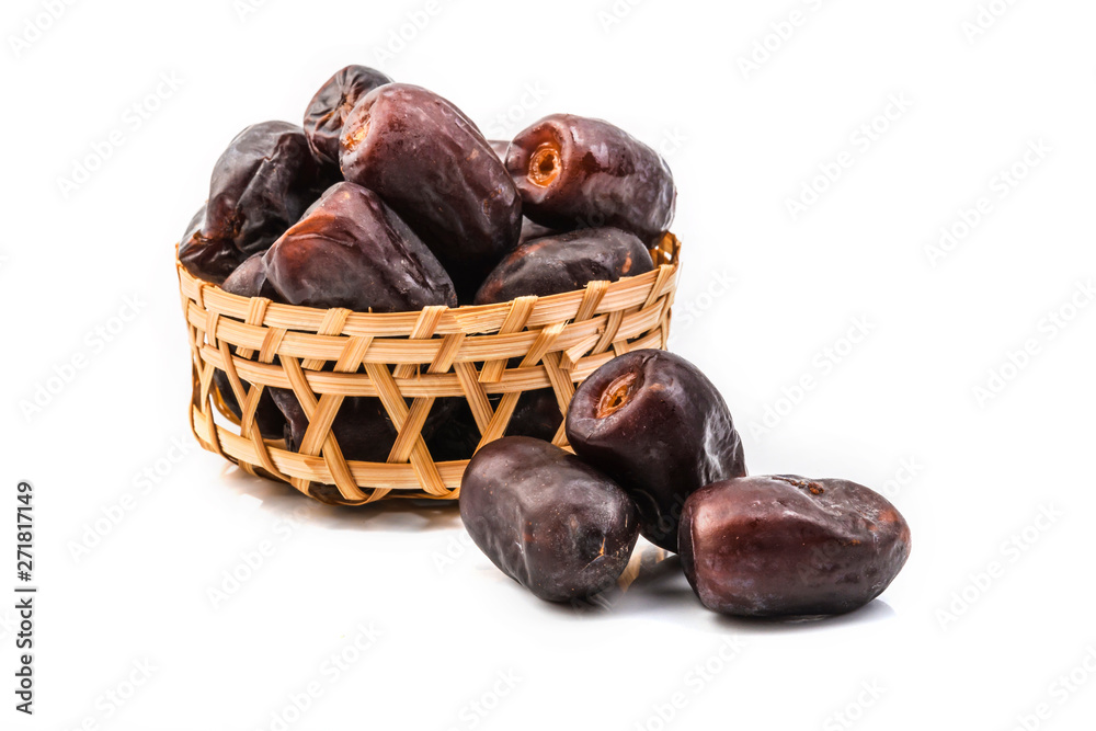 Obraz premium dates in basket isolated on white background