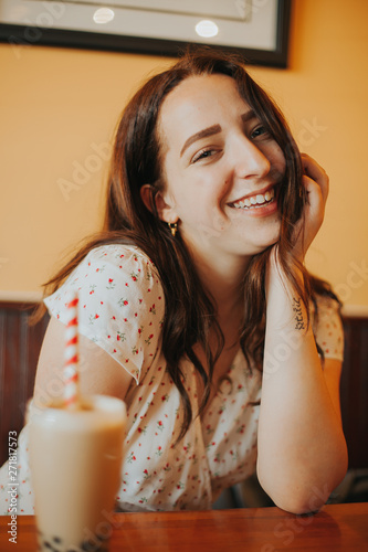 shallow focus photo of woman on white shirt smiling photo