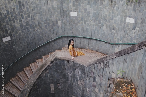 woman sitting on stair raillings photo