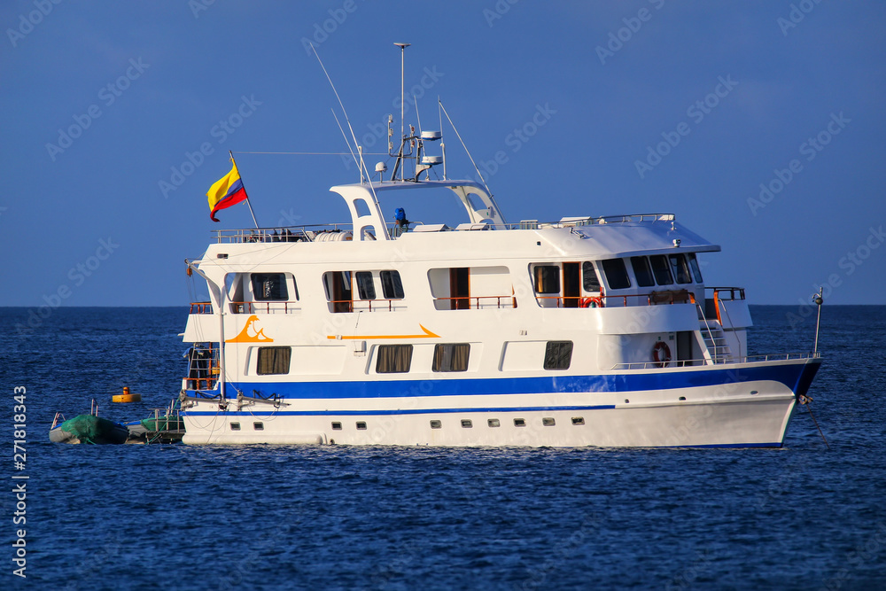 Naklejka premium Typical tourist yacht anchored at Suarez Point at Espanola Island, Galapagos National park, Ecuador