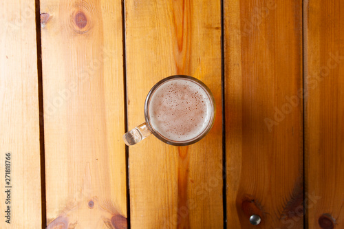 Snapshot of beer mug from the top standing on the table