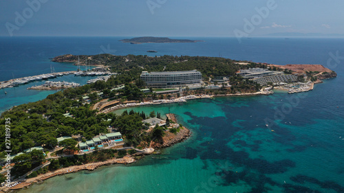 Aerial drone bird's eye panoramic photo of famous celebrity sandy beach of Astir or Asteras in south Athens riviera with turquoise clear waters, Vouliagmeni, Greece © aerial-drone