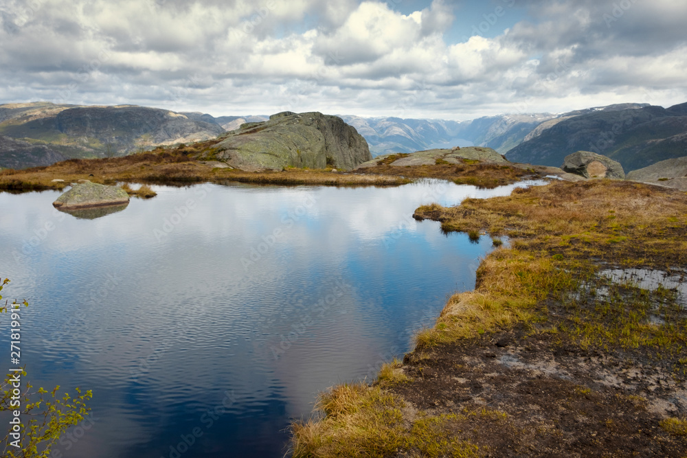 Nature, the landscape of Norway, a small lake on a high rock plateau above   lysefjord