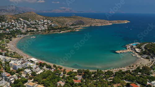Fototapeta Naklejka Na Ścianę i Meble -  Aerial drone bird's eye panoramic photo of famous celebrity sandy beach of Astir or Asteras in south Athens riviera with turquoise clear waters, Vouliagmeni, Greece