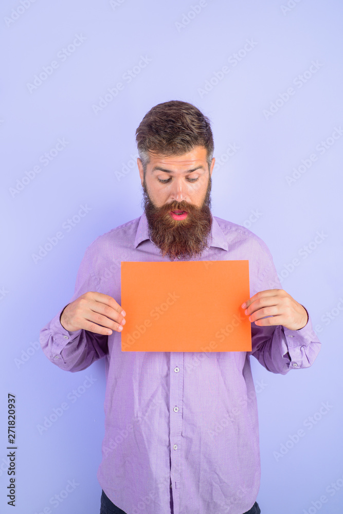 Surprised bearded man holding little advertising board. Advertising. Sale. Online shopping. Advertising banner. Discount. Add. Copy space for text. Seasons sale. Surprised bearded man holding little advertising board. Advertising. Sale. Online shopping. Advertising banner. Discount. Add. Copy space for text. Seasons sale.