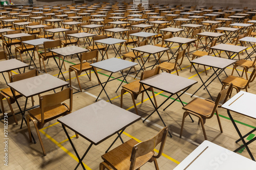 Exam tables set up in a sports hall for exams in a high school & sixth form