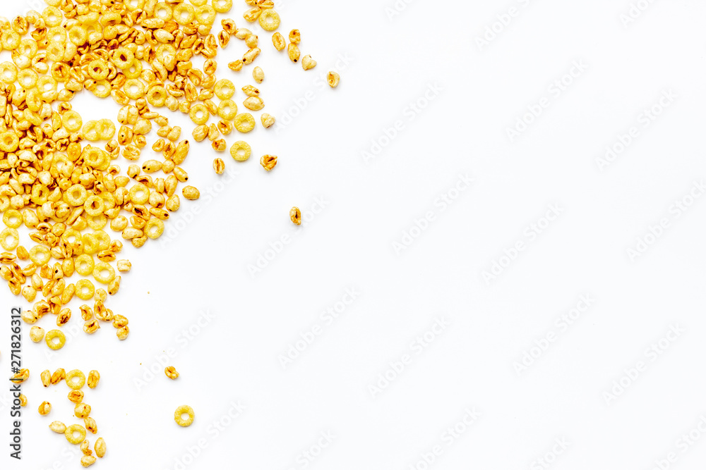 Corn cereals on white background top view space for text Corn cereals on white background top view space for text