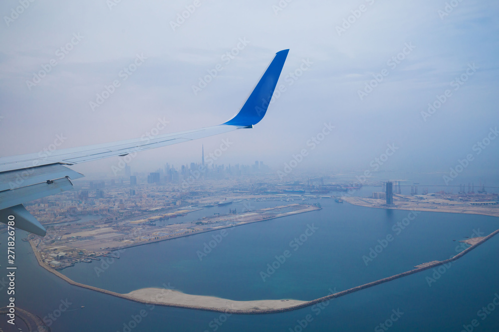 UAE. View on city Dubai in airplane flight UAE. View on city Dubai in airplane flight