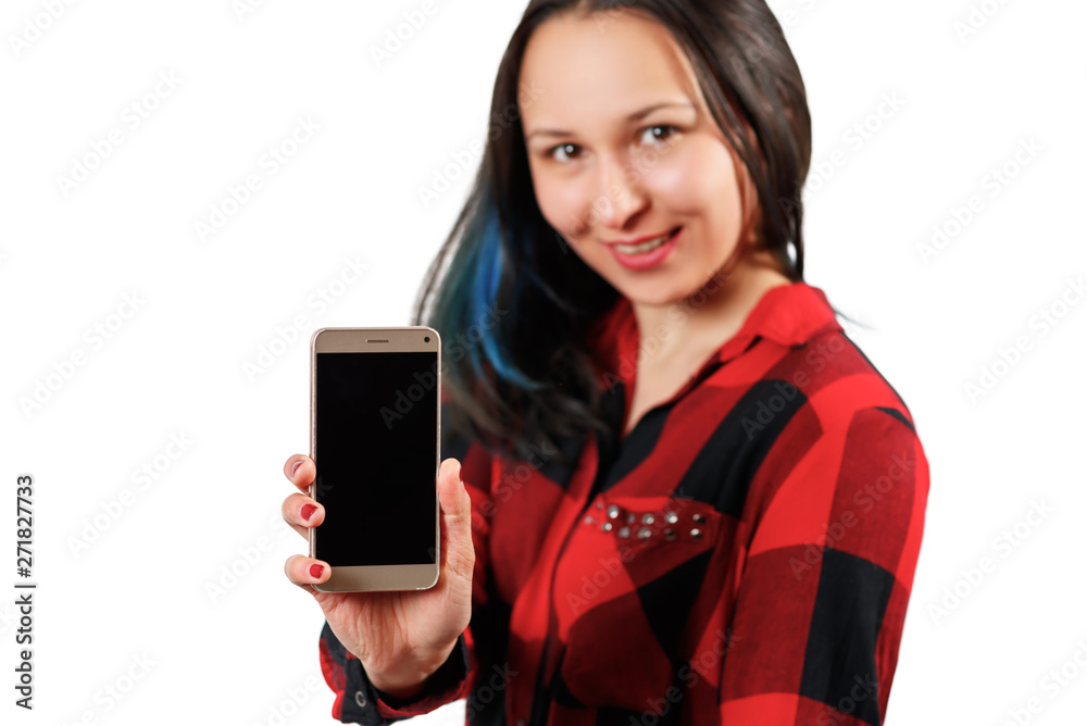 a young girl woman in a red and black shirt is holding a smartphone with a blank black screen vertically in front of her a young girl woman in a red and black shirt is holding a smartphone with a blank black screen vertically in front of her