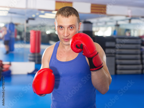 Active adult male who is training in box gym © JackF